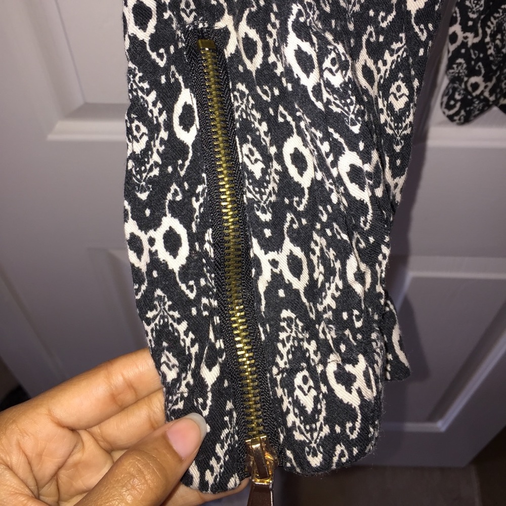 Black & Cream jogger pants with a gold zipper